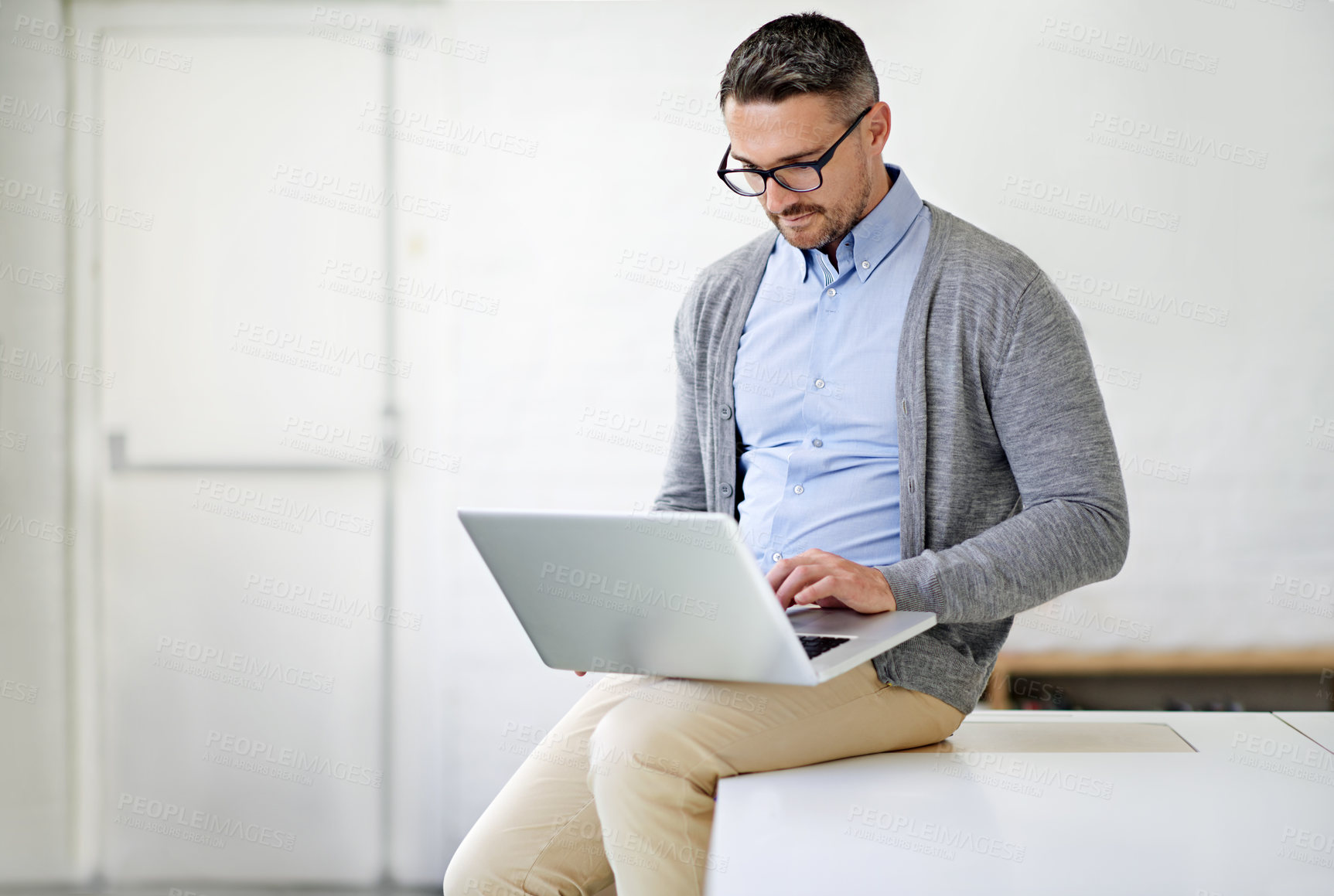 Buy stock photo Laptop, research and man on desk in office for it support in startup company for project. Working, read and male software engineer with computer for troubleshooting online for could computing systems