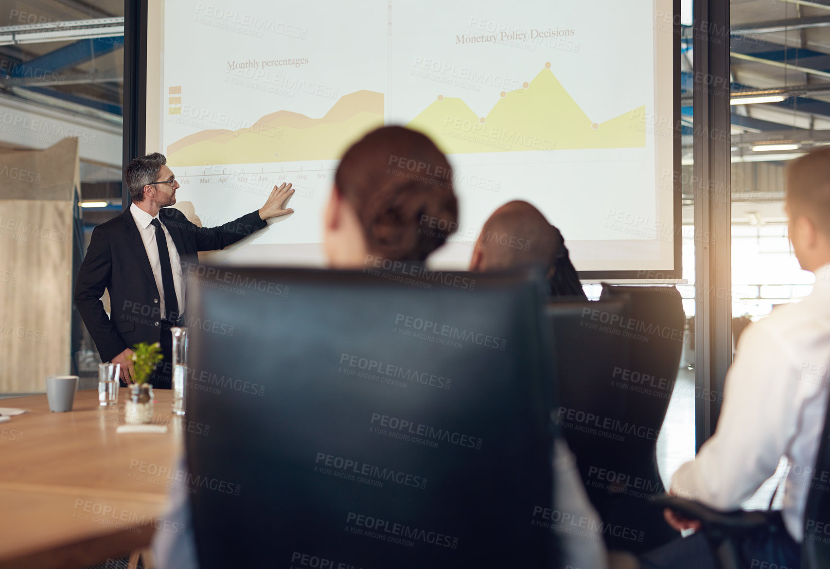 Buy stock photo Boardroom, presentation and group in meeting, monitor and  controller with financial report and teamwork. Business, speaker and people in office, listening and discussion of sales graph and analysis