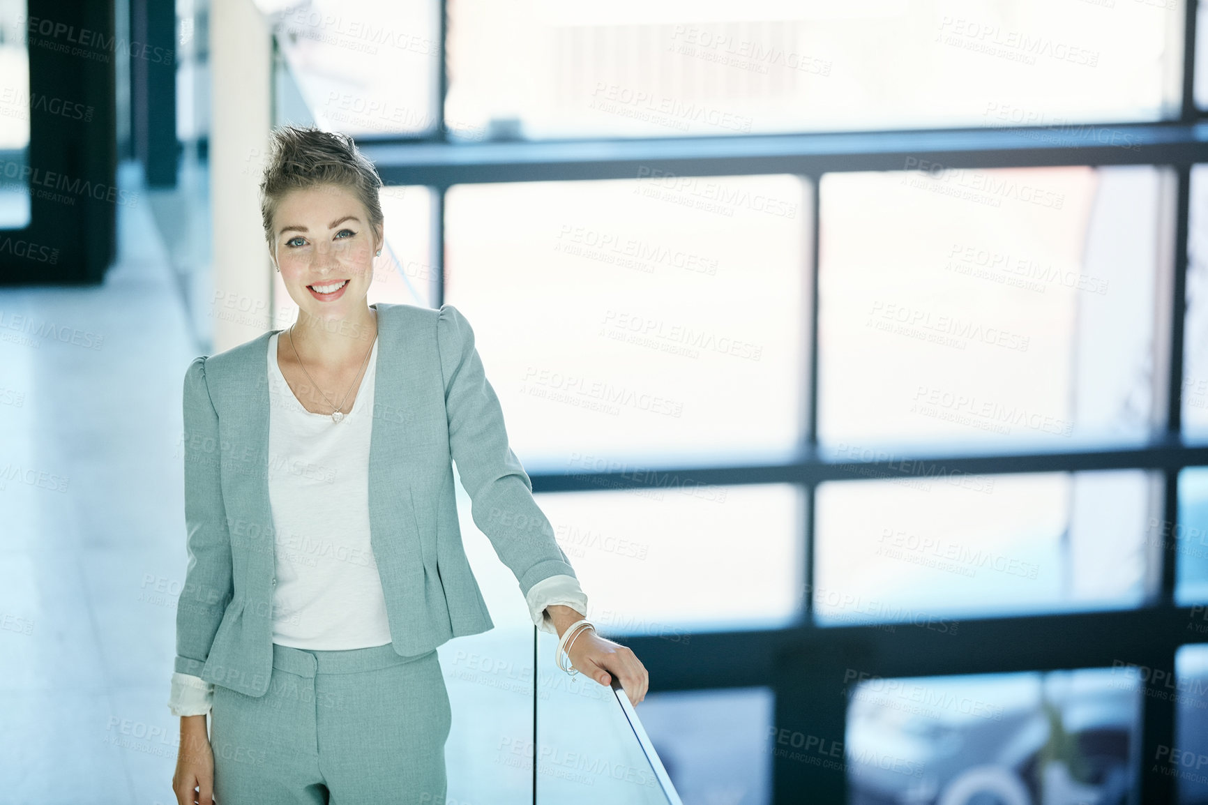 Buy stock photo Portrait of a young businesswoman standing in an office