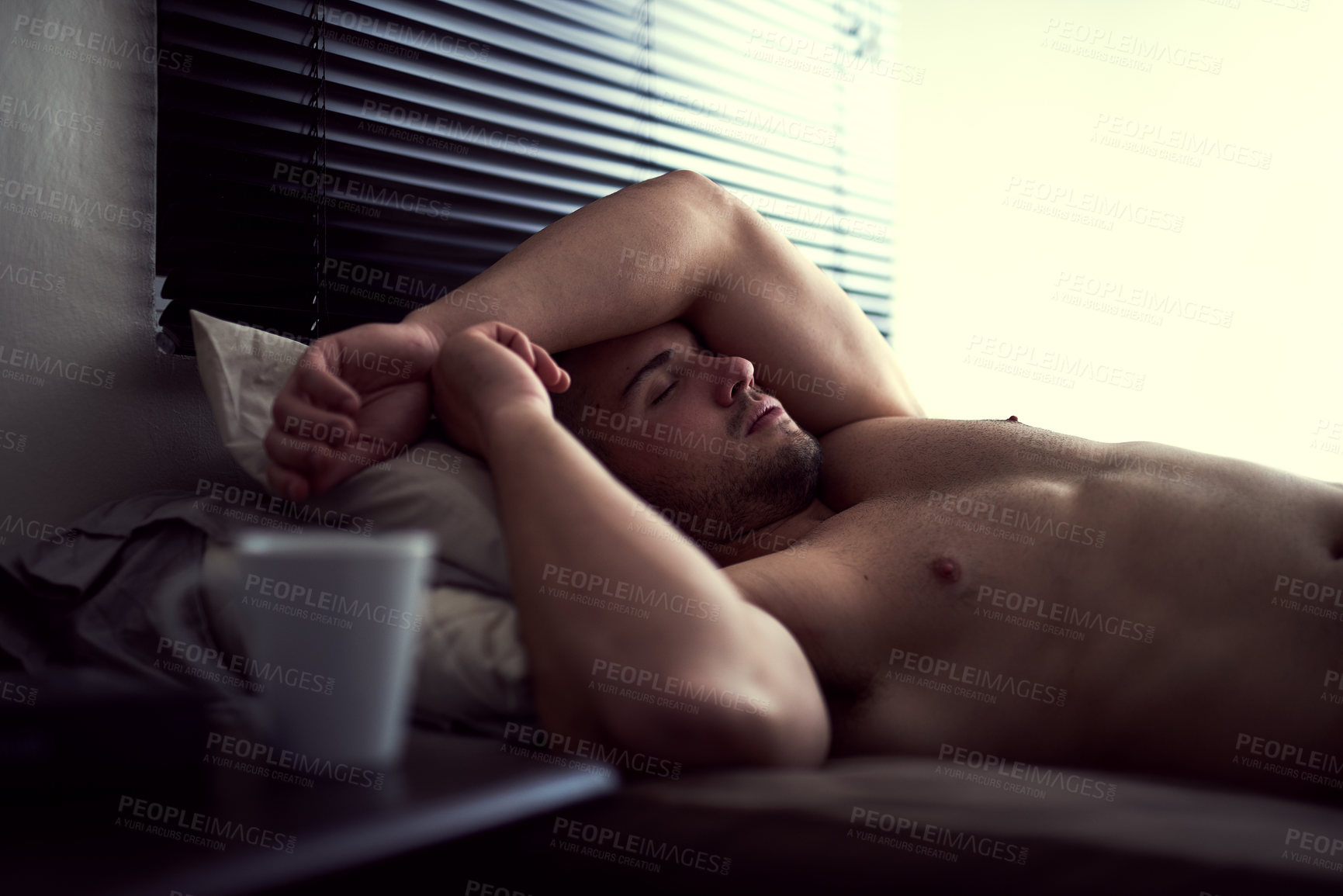 Buy stock photo Man, sleeping and morning in bed, peace and lazy on weekend or comfortable in bedroom apartment. Male person, dreaming and tired to rest or relax in home, shirtless and fatigue for nap wellness