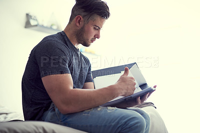 Buy stock photo Document, man and student in home with studying for test or exam, weekend revision and learning for knowledge. Bedroom, male person and reading paperwork for assessment with education and scholarship