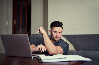 Buy stock photo Man, laptop and table in living room with book, remote work and small online business startup. Technology, freelance or planning from home, paperwork and internet for virtual training or webinar