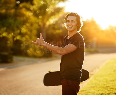 Buy stock photo Portrait, man and skate with hand in outdoor on board for energy to travel for adventure as sport for practice in summer. Happy, male person and skater with hobby for health by training in road