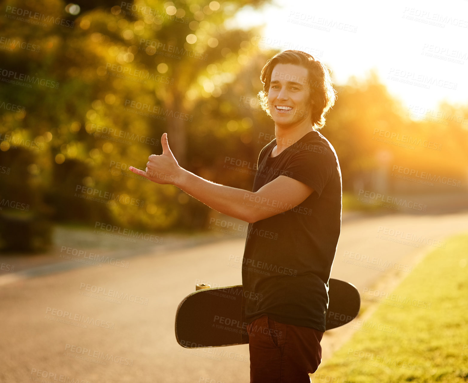 Buy stock photo Portrait, man and skate with hand in outdoor on board for energy to travel for adventure as sport for practice in summer. Happy, male person and skater with hobby for health by training in road