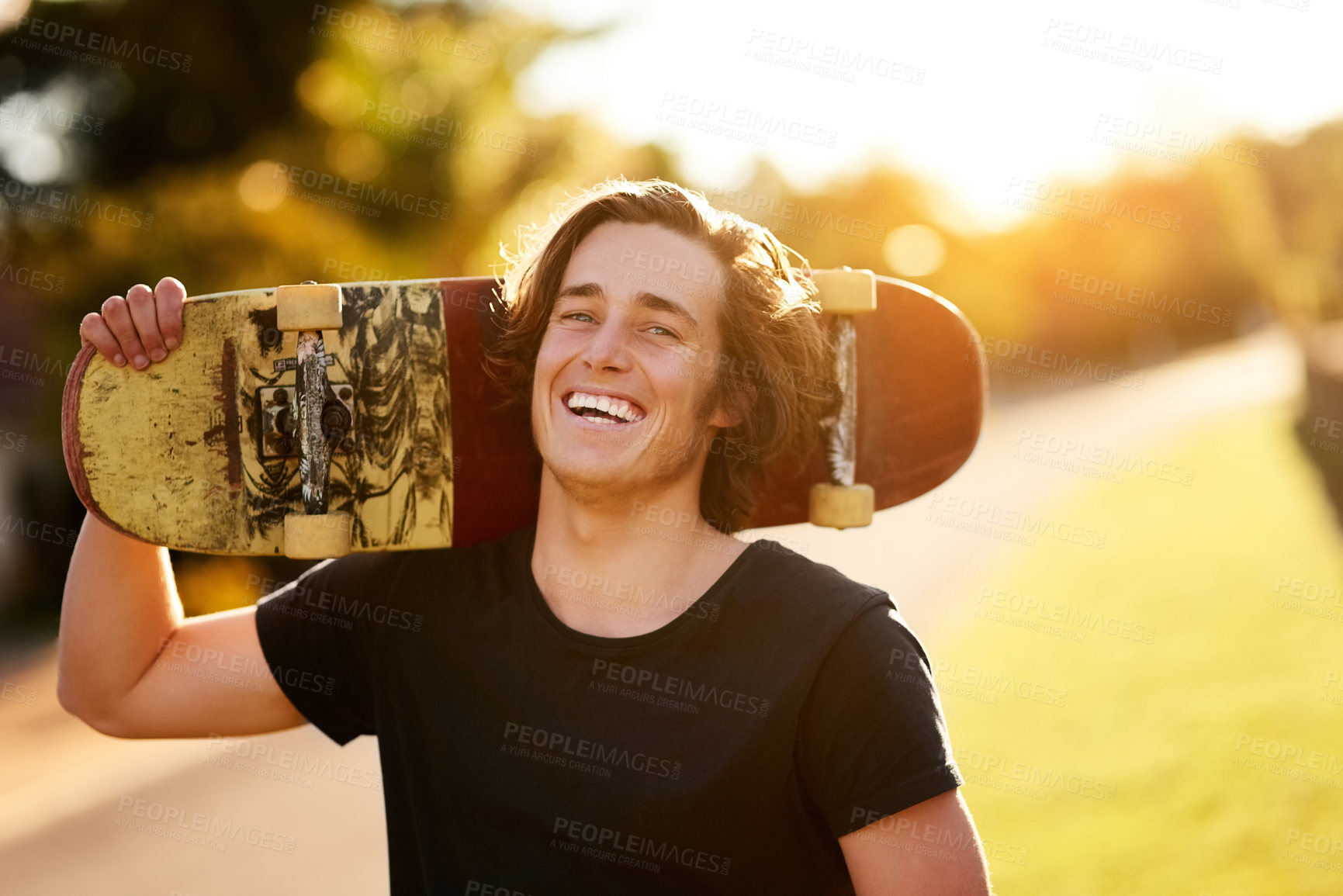 Buy stock photo Portrait of a young man standing with his skateboard outside