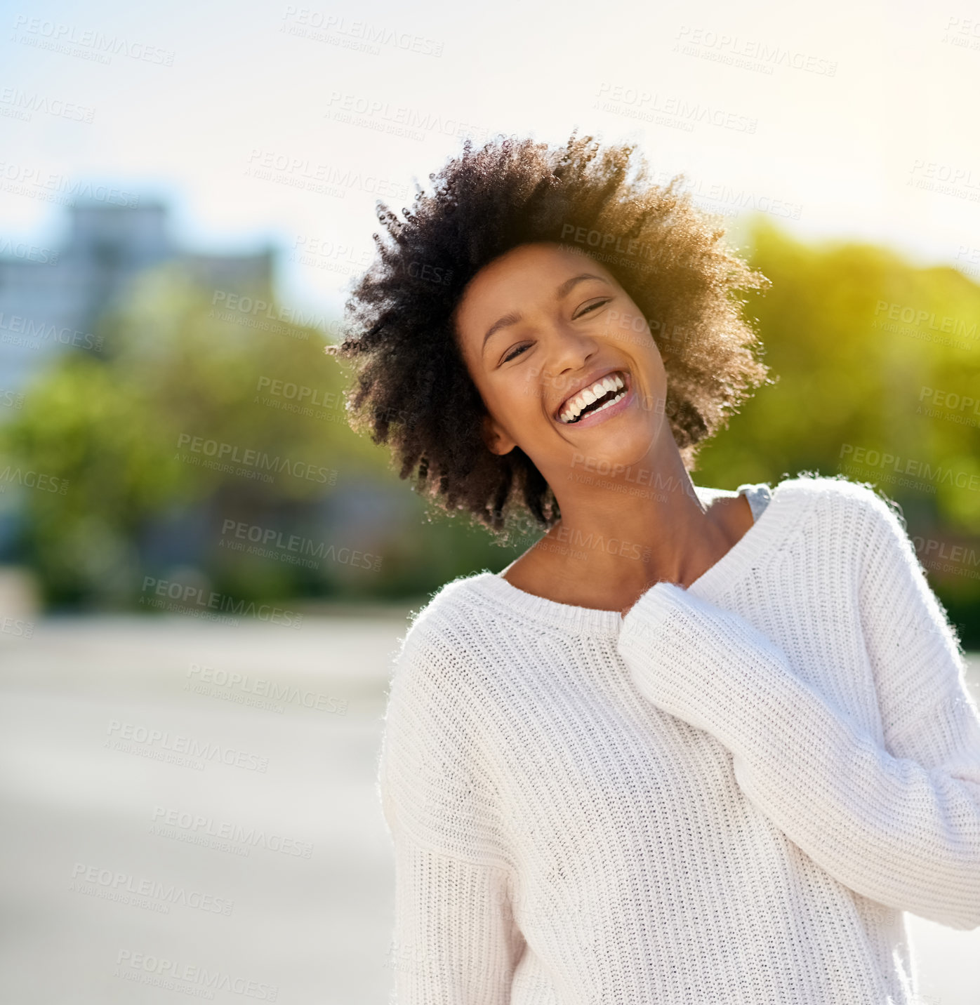 Buy stock photo Shot of a happy young woman going in the city