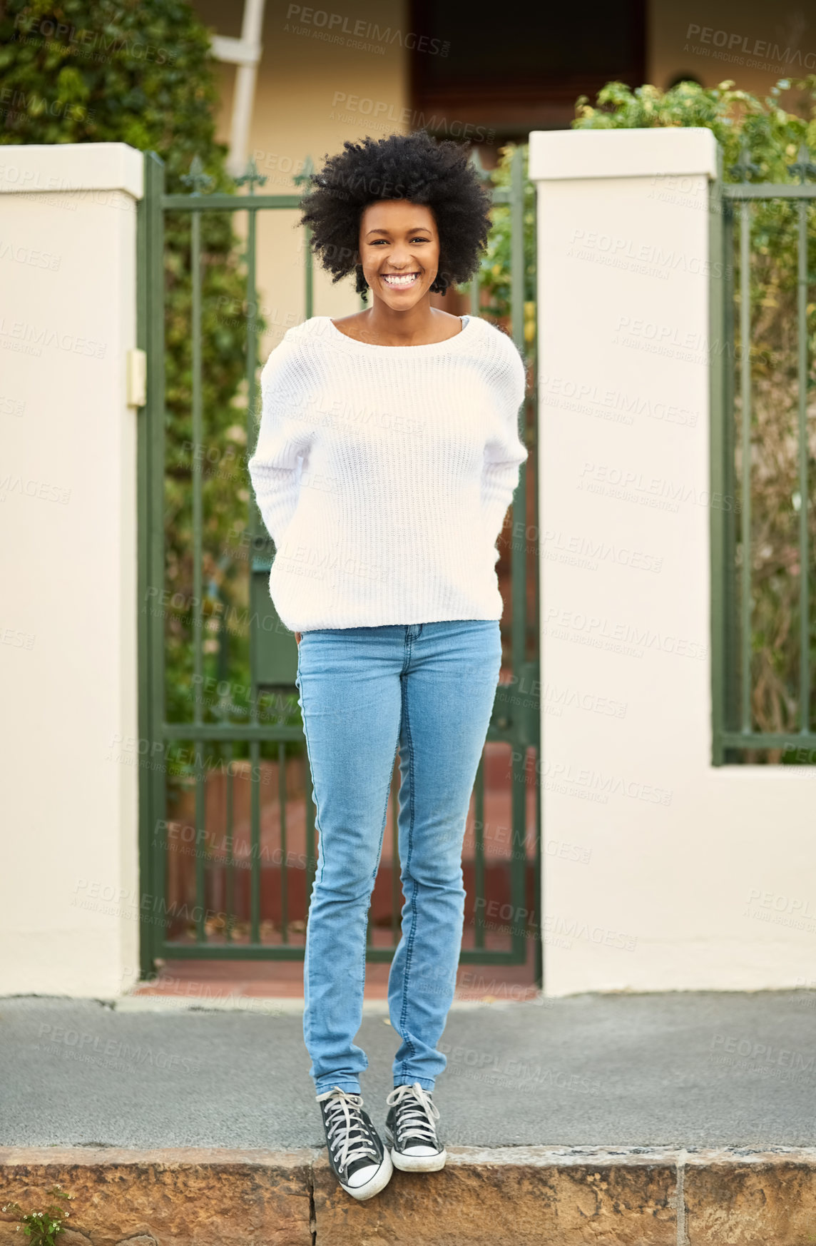 Buy stock photo Black woman, happy and outside standing on sidewalk, home and gate with smile female person. Calm, peaceful and comfortable, African and proud or positive infront of house for fresh air with trees