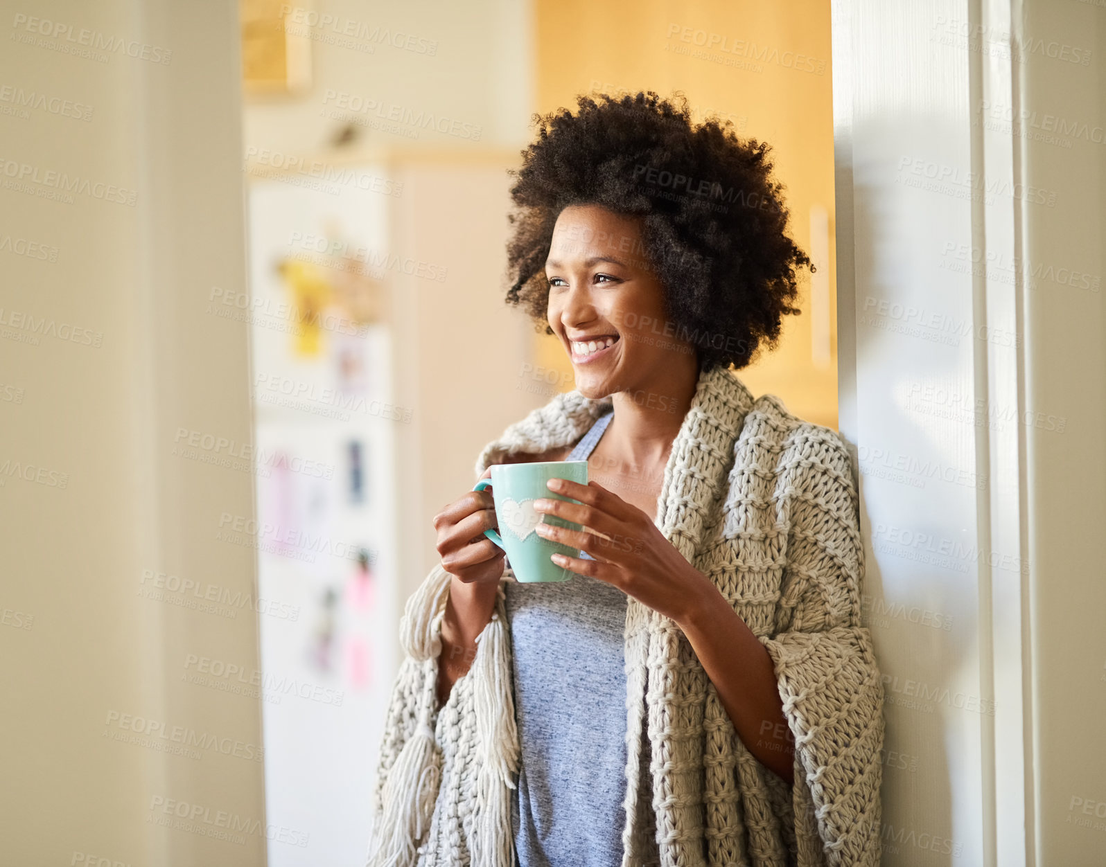 Buy stock photo Shot of a happy young woman drinking a cup of coffee in the morning at home