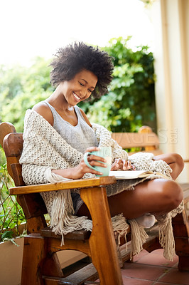 Buy stock photo African, home reading and garden with woman in backyard with book and coffee feeling relax and happy. Happiness, black female person on a patio in the morning with novel outdoor in the sun sitting