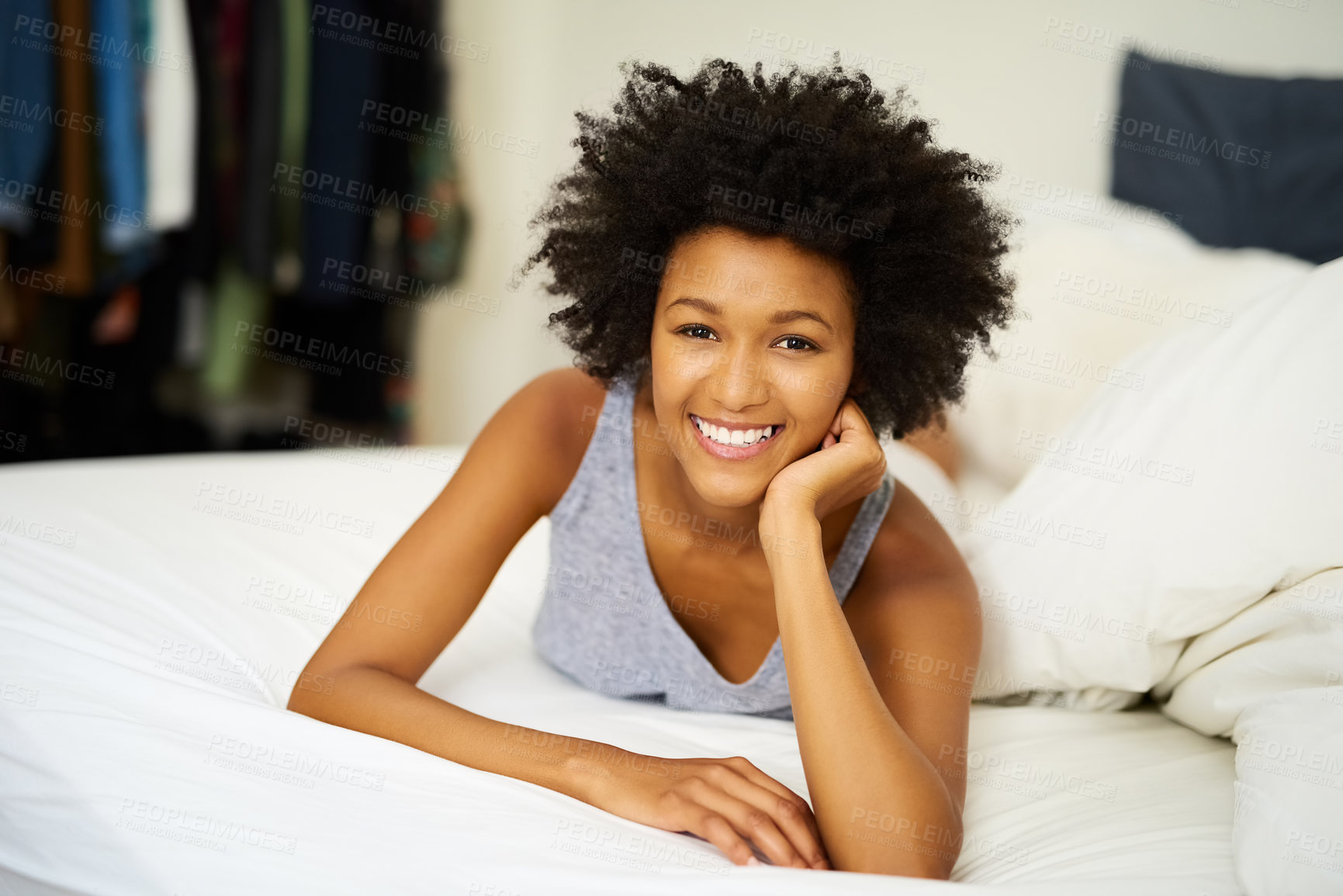 Buy stock photo Black woman, portrait and smile in bed for relax, wellness and self care after sleep in house. Female person, happy and peace with duvet or pillow for wake up, health and morning on weekend in London