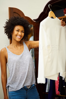 Buy stock photo Black woman, smile and clothes choice at closet in home, getting ready and morning preparation. Wardrobe, fashion and girl with decision in bedroom, fabric and think of textile for dressing in house