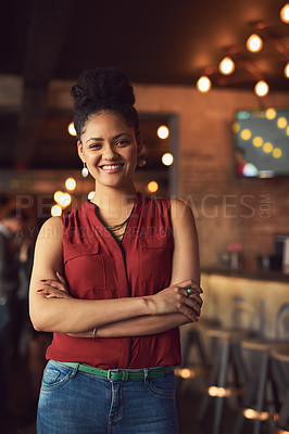 Buy stock photo Portrait of a young woman standing in a cafe