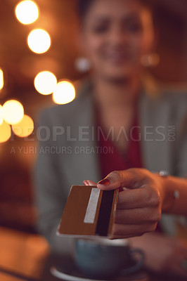 Buy stock photo Closeup shot of a young woman holding out a credit card