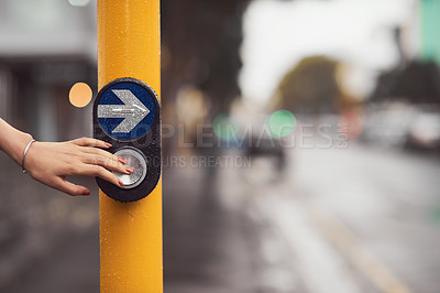 Buy stock photo Closeup shot of a woman pressing a button at a cross walk