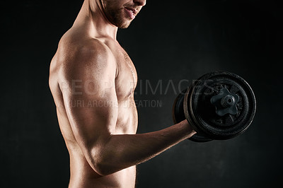 Buy stock photo Man, strong and lifting weight by studio backdrop for exercise, wellness and muscle training. Male athlete, fitness and dumbbell by dark background for bodybuilding and equipment for workout in gym