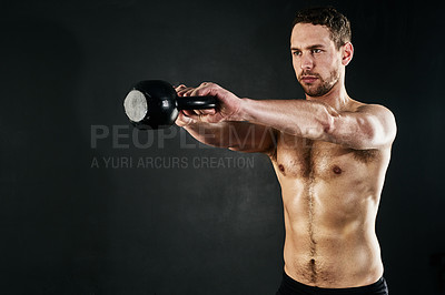 Buy stock photo Kettlebell, fitness and man with exercise, training and challenge on dark studio background. Healthy person, model and athlete with equipment, core workout or strong with endurance, cardio or energy