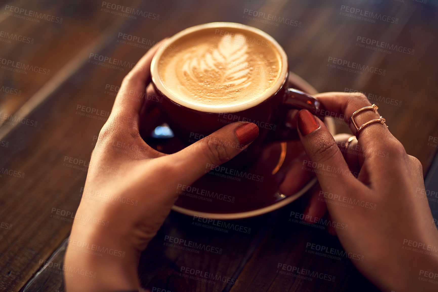 Buy stock photo Coffee cup, hands and woman in cafe for drink, caffeine and restaurant for cappuccino. Customer, hospitality and milk art with foam for female person, morning and barista for breakfast in store