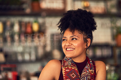 Buy stock photo Cropped shot of an attractive young woman sitting in a cafe