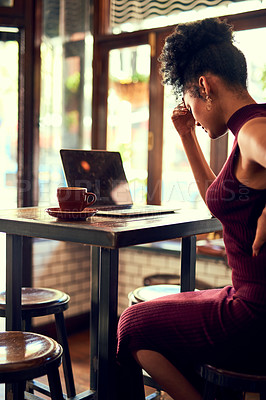 Buy stock photo Cropped shot of a young woman experiencing discomfort while working on her laptop in a cafe