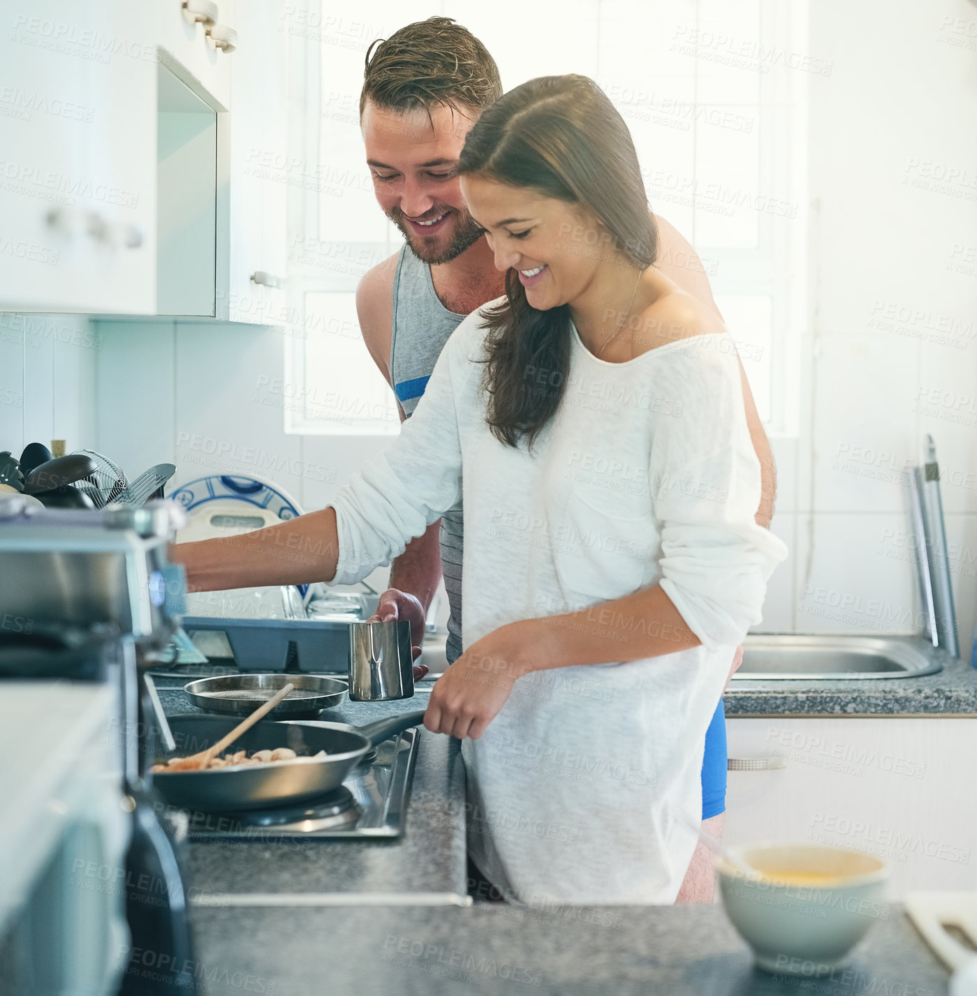 Buy stock photo Cooking, pan and couple in kitchen with food for meal prep for breakfast, lunch and frying in home. Love, dating and man and woman with ingredients on stove for healthy eating, wellness and nutrition