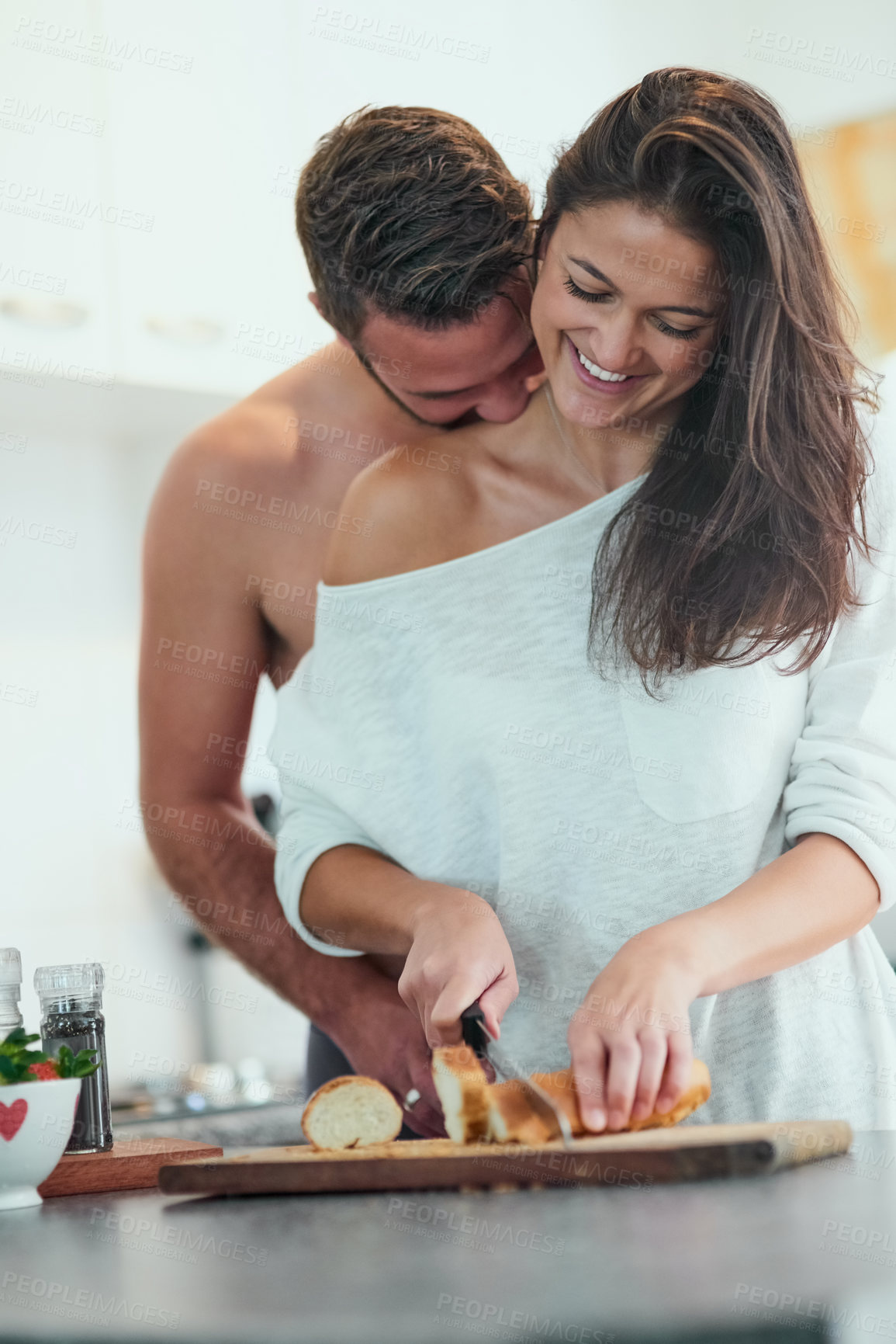 Buy stock photo Cooking, bread and couple in kitchen with food for meal prep for dinner, supper and lunch in home. Love, dating and man and woman with vegetable ingredients for healthy eating, wellness and nutrition