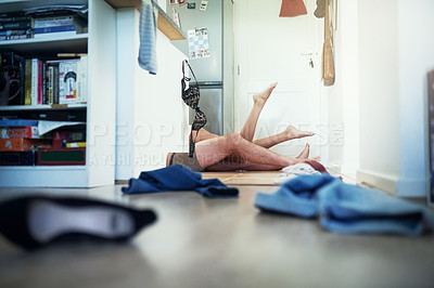 Buy stock photo Shot of an unidentifiable young couple making love on the kitchen floor