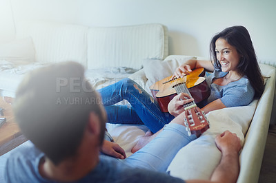 Buy stock photo Couple, guitar and relax on sofa with music in morning with care, bonding and creative in home living room. Man, woman and artist with smile, thinking and singing on couch in lounge at apartment