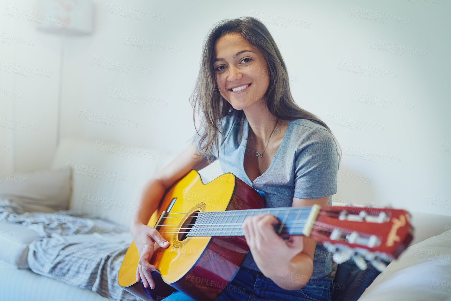 Buy stock photo Woman, guitar and smile on sofa for portrait with music, creativity and relax in home living room. Girl, person or musician with instrument for sound, art and happy on couch in lounge at apartment