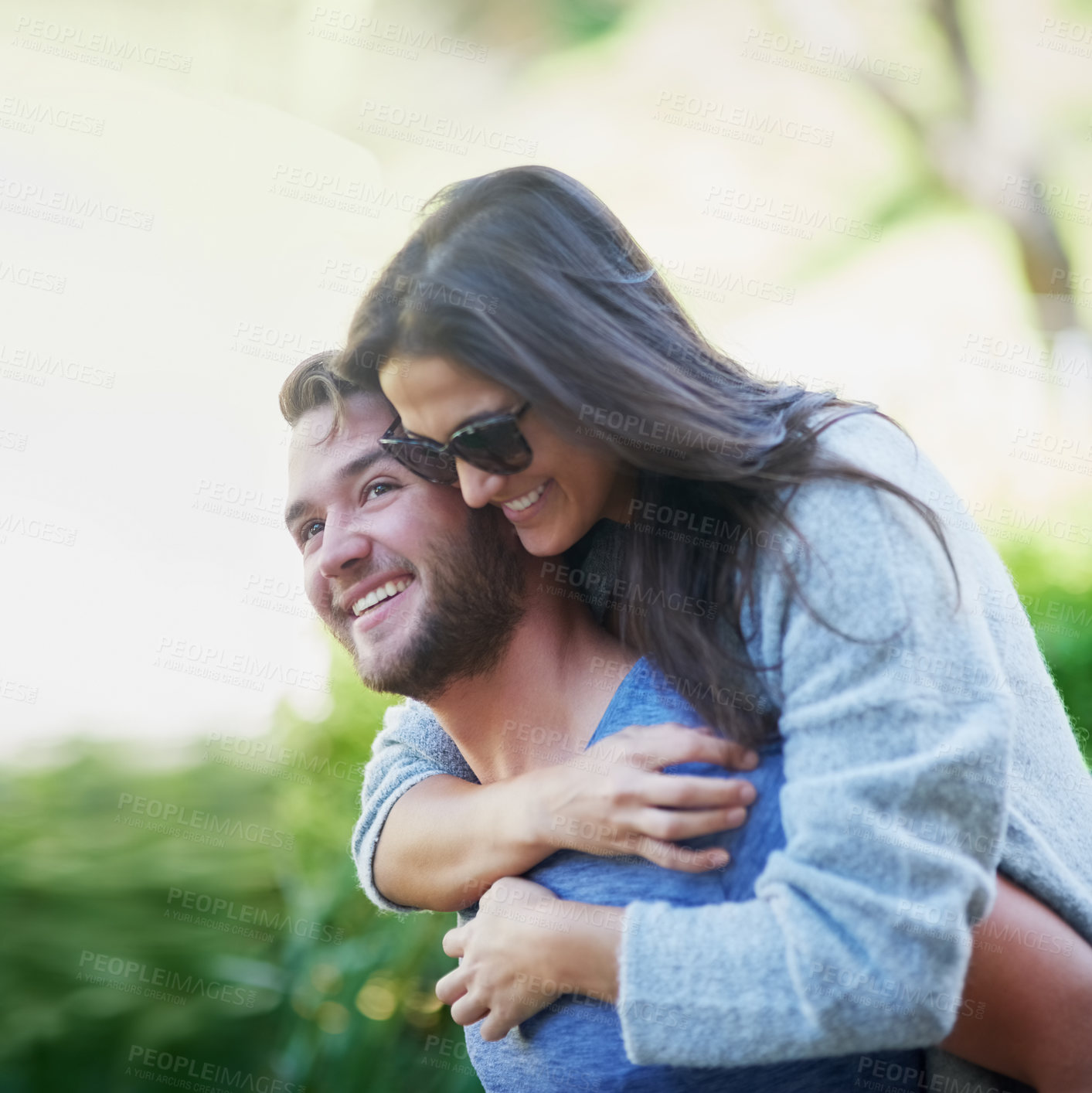 Buy stock photo Couple, piggy back and smile at park in summer with nature, holiday or playful adventure with love. Man, woman and excited with comic game, memory and laugh together on walk with sunshine in garden