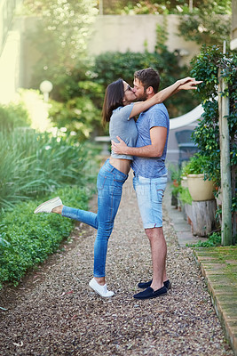 Buy stock photo Couple, hug and kiss in garden, outdoor and connection with love, romance and vacation in spring. Man, woman and embrace with care, kindness and bonding on dirt path in backyard in summer sunshine