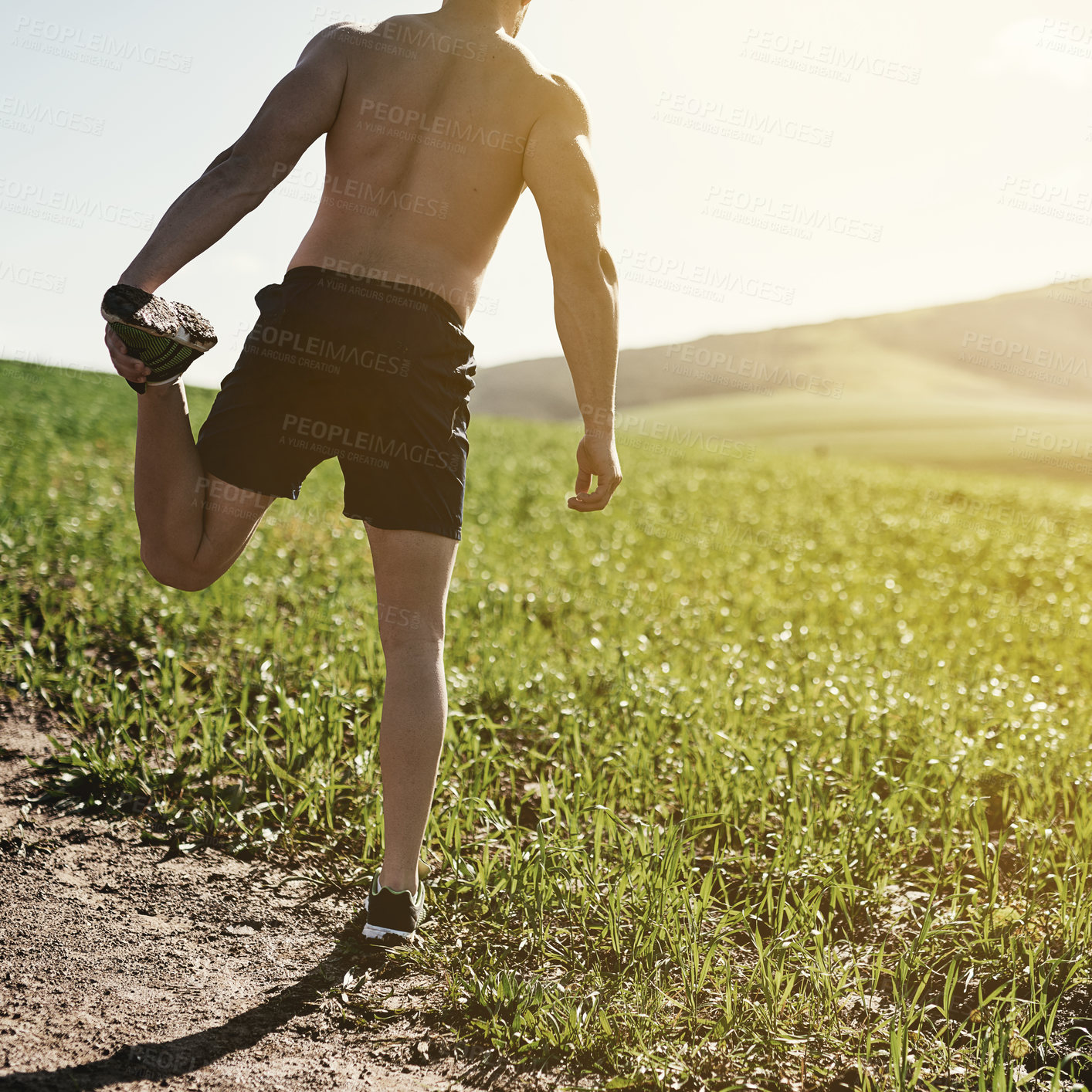 Buy stock photo Runner, countryside or man stretching legs for training, exercise or fitness workout in nature. Muscle warm up, back or sports athlete ready to start practice for wellness, body or running on grass