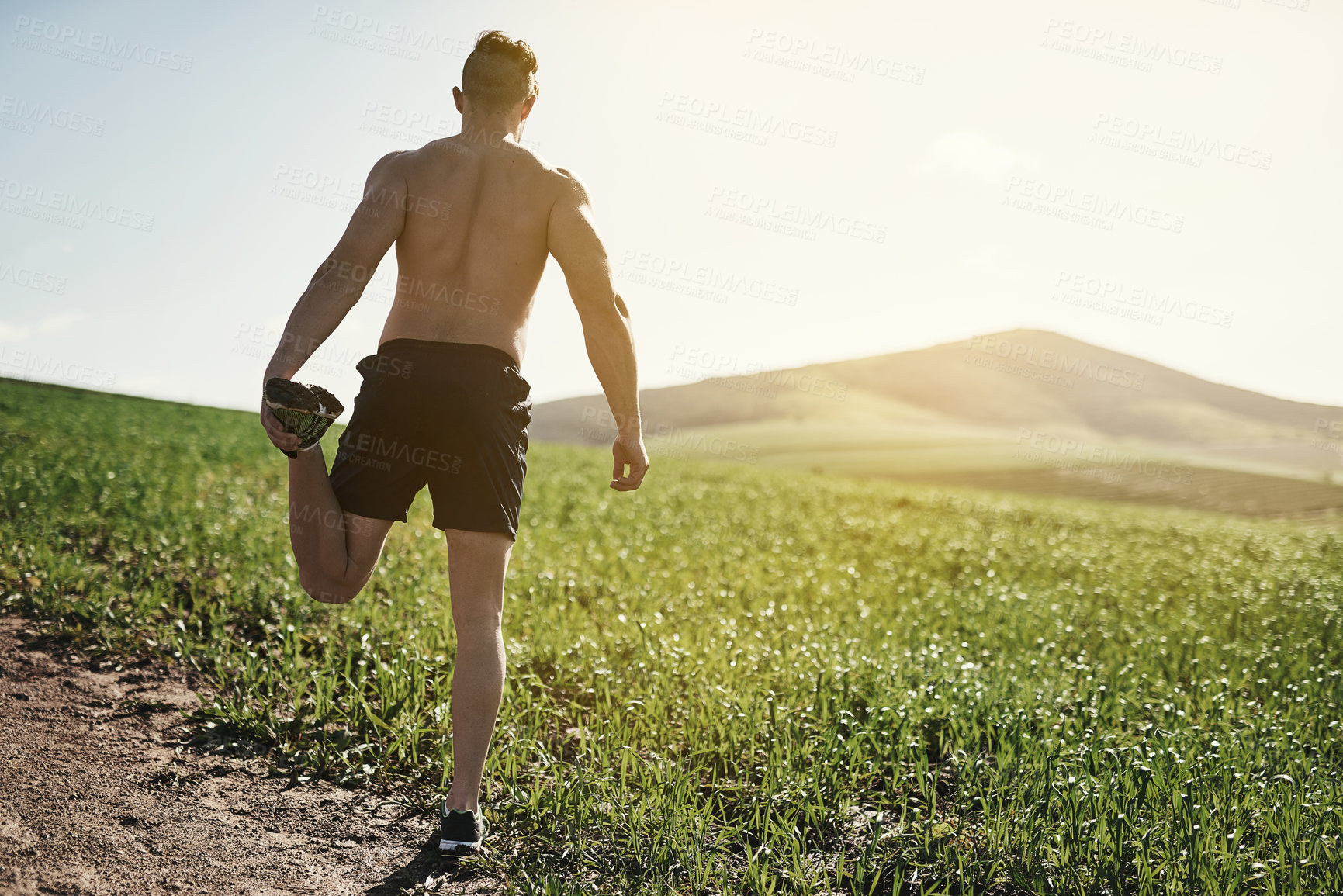 Buy stock photo Back, exercise and man in nature for stretching with strong body, running and routine for start workout. Outdoor, stretch leg and male runner with muscle warm up for discipline and sports training