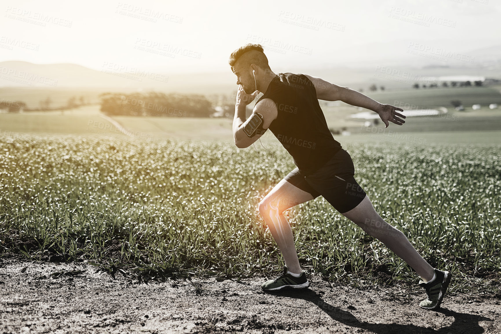 Buy stock photo Full length shot of a young man running with an injury highlighted by cgi