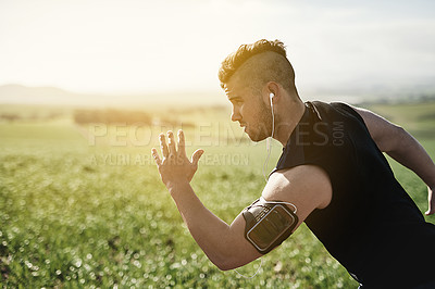 Buy stock photo Cropped shot of a handsome young man running outdoors