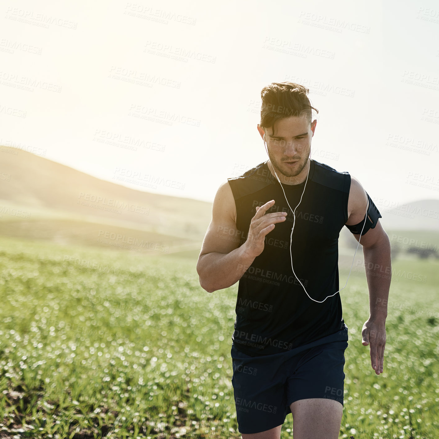 Buy stock photo Cropped shot of a handsome young man running outdoors