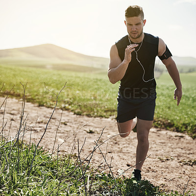 Buy stock photo Full length shot of a handsome young man running outdoors