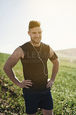 Buy stock photo Man, earphones and confident running portrait in outdoor, marathon training and health in countryside. Male person, streaming and song for workout in nature, fitness and proud of cardio or music