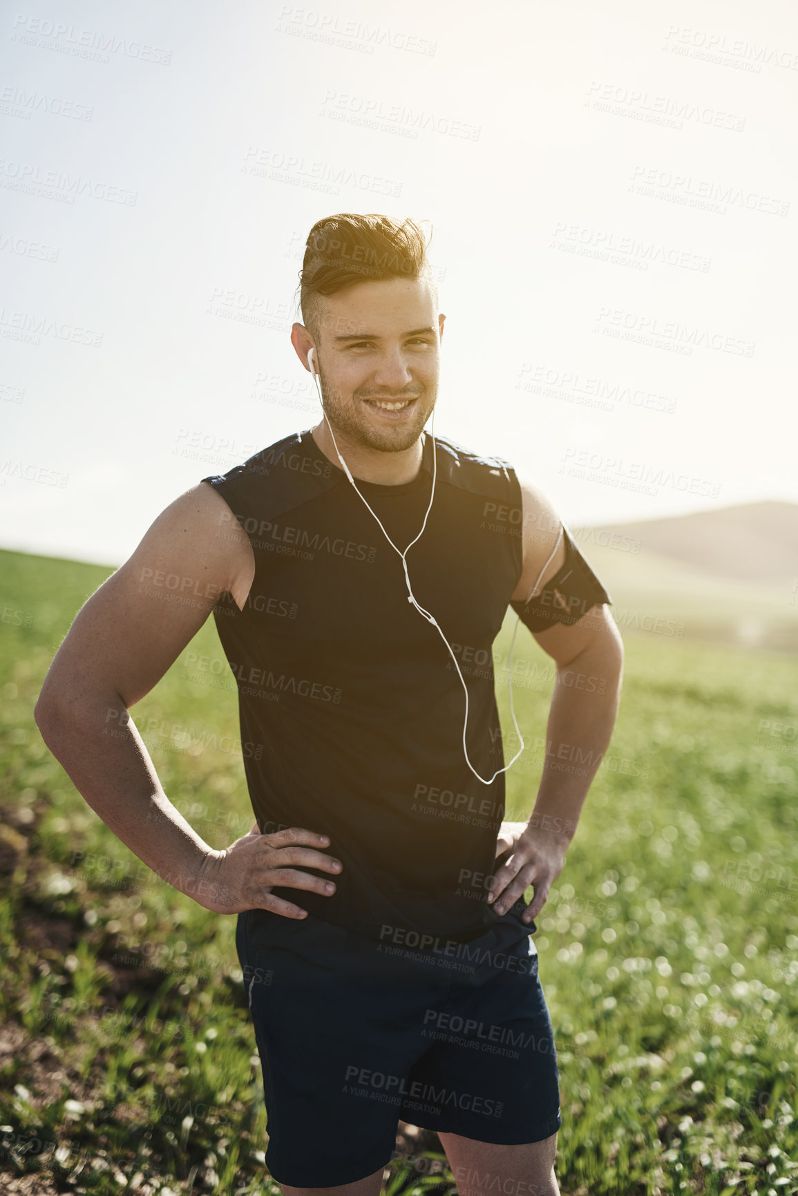 Buy stock photo Man, earphones and confident running portrait in outdoor, marathon training and health in countryside. Male person, streaming and song for workout in nature, fitness and proud of cardio or music