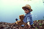 Just him and his teddy in the great outdoors