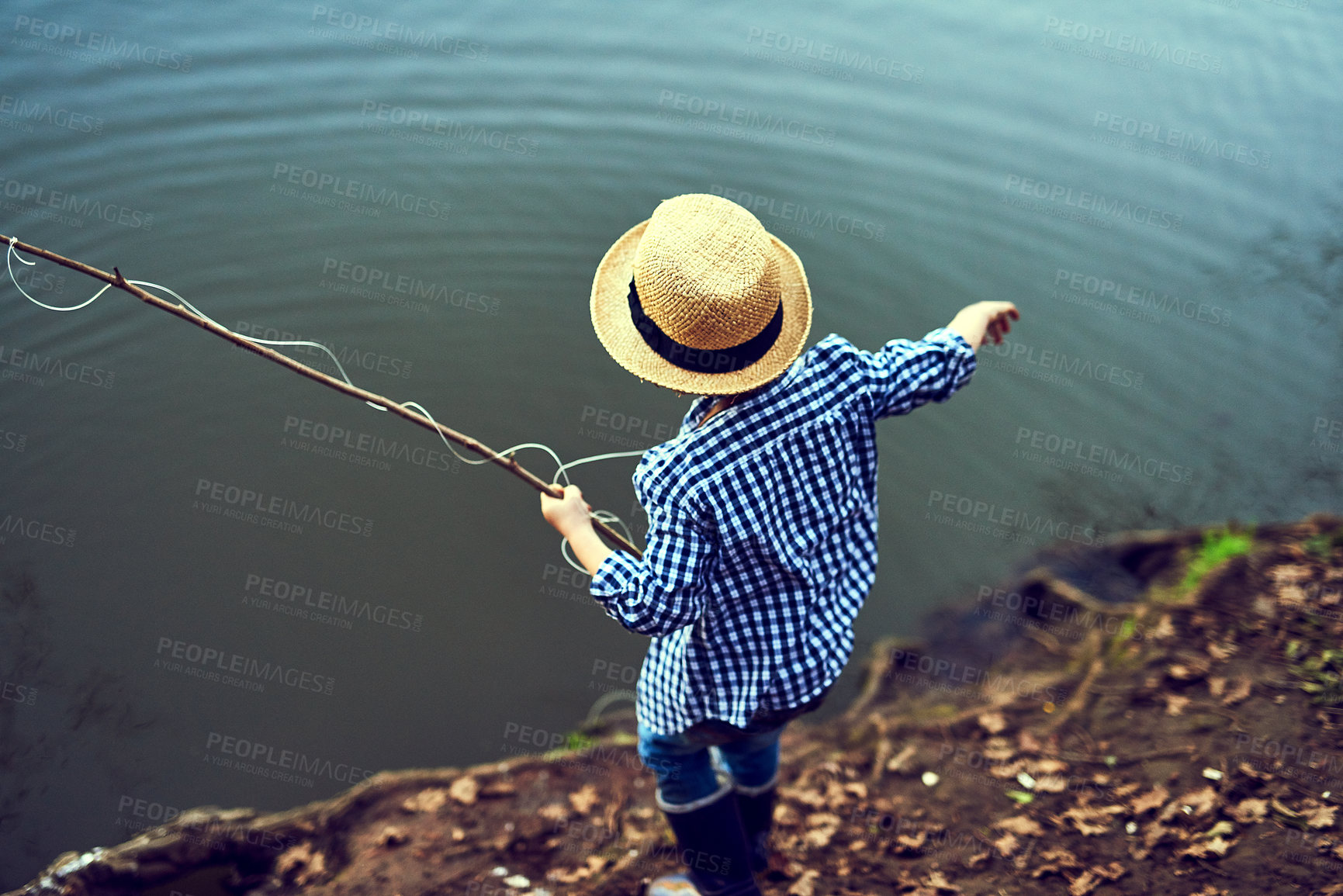 Buy stock photo Lake, water and boy fishing on holiday, adventure or weekend trip for autumn hobby. Back, nature and child or kid catching fish in pond on outdoor vacation in scotland countryside with straw hat