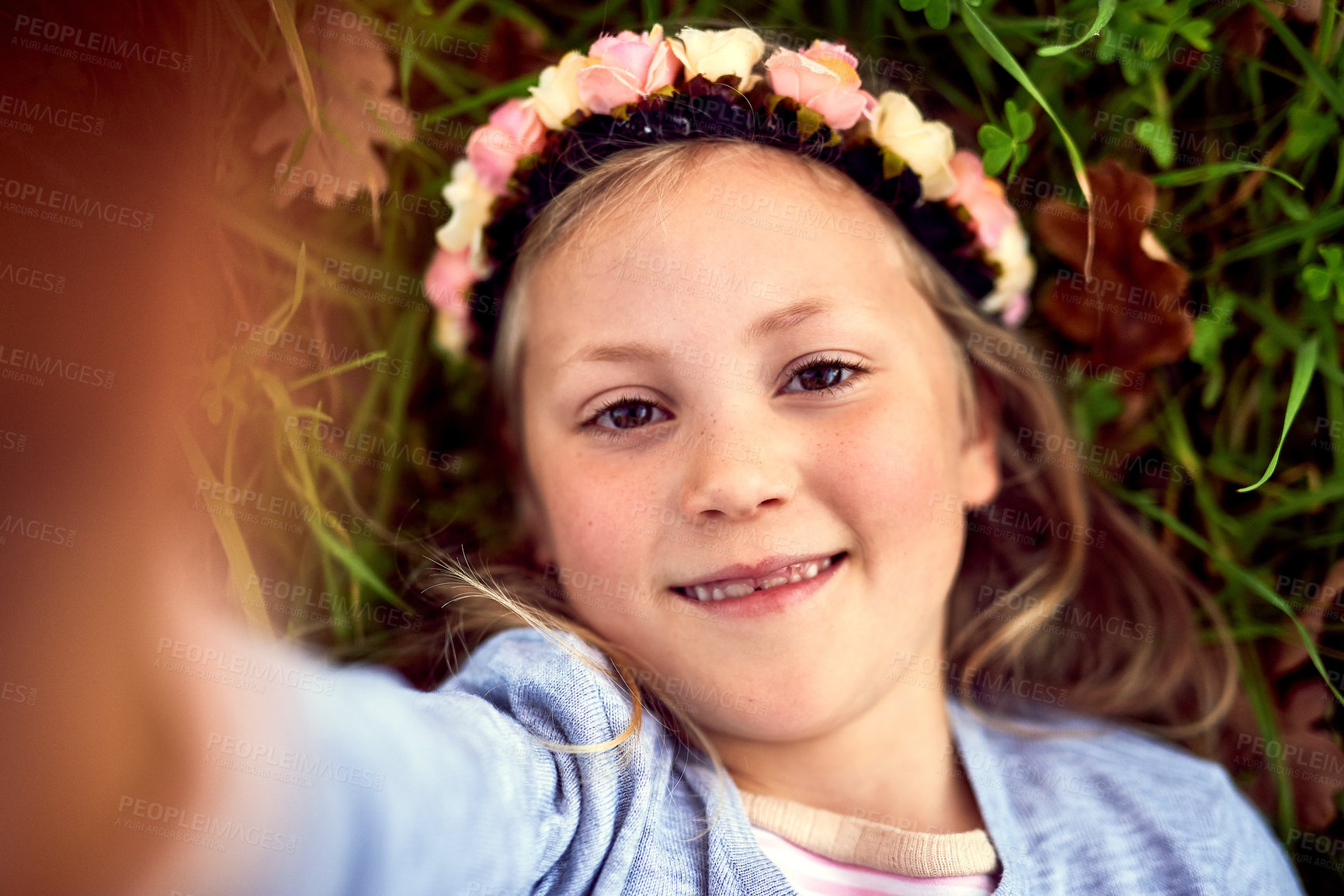 Buy stock photo Girl, child and selfie on grass with portrait outdoor for fun or playing, fresh air and enjoyment of youth or childhood in summer. Female kid, happy and photography in nature for memory and adventure