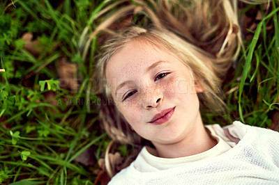 Buy stock photo Portrait of a young girl enjoying some time outdoors