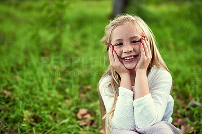 Buy stock photo Girl, child and happy on grass with portrait outdoor for fun or playing, fresh air and enjoyment of youth or childhood in summer. Female kid, relax and nature in afternoon for carefree and adventure.