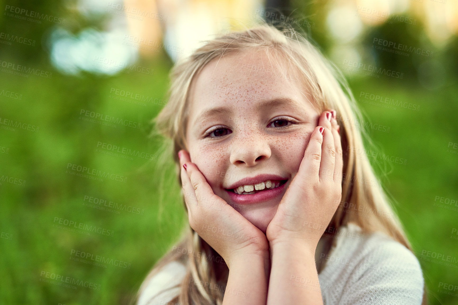 Buy stock photo Girl, child and smile on grass with portrait outdoor for fun or playing, fresh air and enjoyment of youth or childhood in summer. Female kid, relax and nature in afternoon for carefree and adventure.