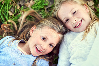 Buy stock photo Top view, portrait and kids laughing on grass outdoor for bonding, play and family relax at park. Above, face and happy children on lawn, girls and funny sisters together at garden on summer holiday