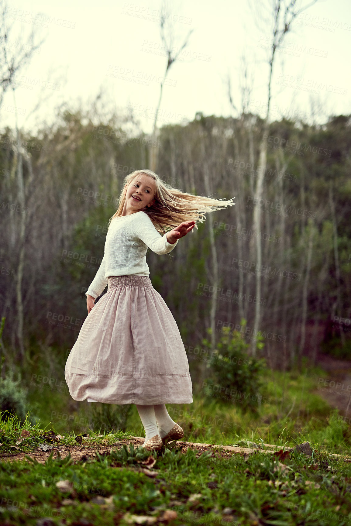 Buy stock photo Outdoor, girl and kid in nature, happiness and playful with smile, celebration and excited for weekend break. Forest, cheerful and childhood with nature, fun and dance with freedom, relax or carefree