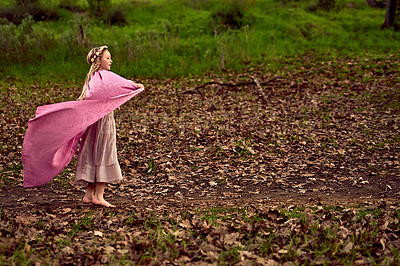 Buy stock photo Nature, fantasy and girl child in woods for outdoor adventure with pink dress costume for fun. Happy, forest and kid exploring with freedom in princess outfit in park or field in Autumn in Canada.