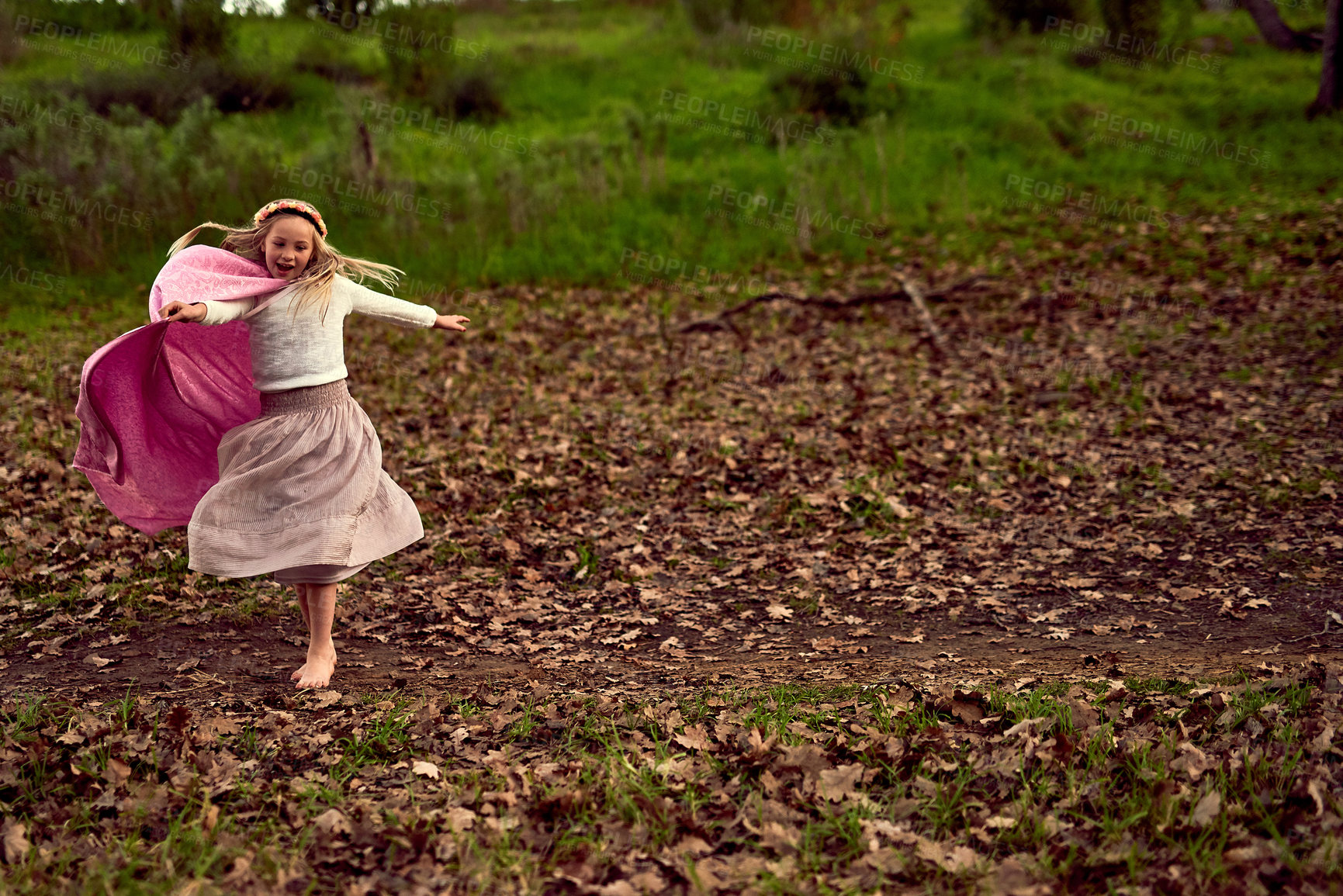 Buy stock photo Shot of a young girl enjoying some time outdoors