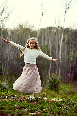 Buy stock photo Shot of a young girl enjoying some time outdoors