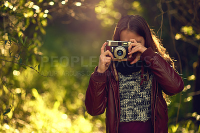 Buy stock photo Vintage camera, nature and girl in park, photography and memory with picture, weekend break and adventure. Outdoor, photographer or explore for journey, hobby or activity in forest, sunshine or retro